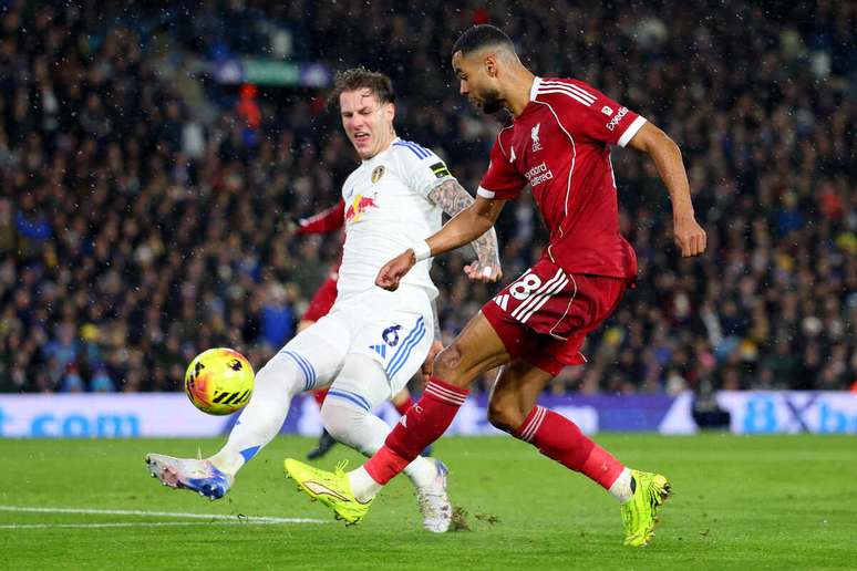 Gakpo delivers a cross past Leeds United's Joe Rodon at Elland Road -