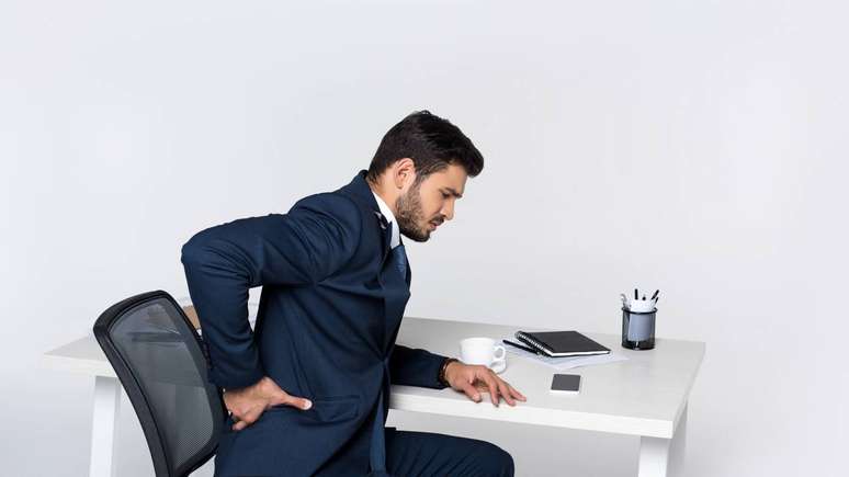 From a musculoskeletal perspective, sitting for long periods tends to overload the lumbar spine, neck and shoulders – depositphotos.com / IgorVetushko