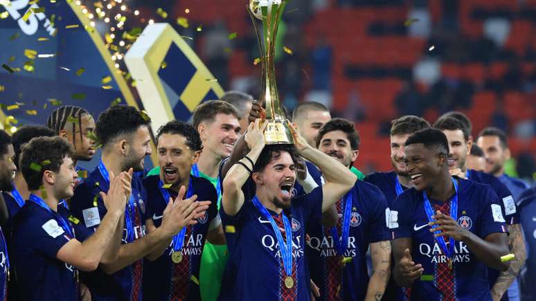 Ahmad Bin Ali Stadium, Al-Rayyan, Qatar - December 17, 2025 Vitinha of Paris St Germain lifts the trophy with his teammates after winning the FIFA Intercontinental Cup final