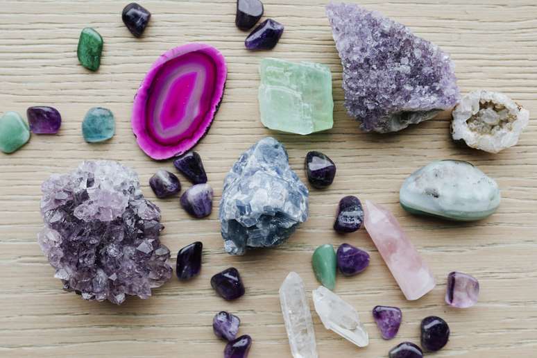 Colorful healing crystals on a wooden table