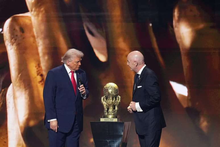 WASHINGTON, DC &ndash; DECEMBER 05: U.S. President Donald Trump receives the FIFA Peace Prize from FIFA President Gianni Infantino at the FIFA World Cup 2026 Official Draw at the John F. Kennedy Center for the Performing Arts December 05, 2025 in Washington, DC. The 2026 FIFA World Cup will take place between June 11 and July 19 featuring 48 teams with matches being played in the United States, Mexico and Canada, the first time the international sporting event will be hosted by three nations. (Photo by Andrew Harnik/Getty Images)