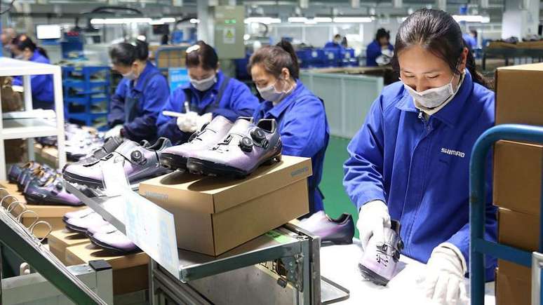 Um ter&ccedil;o dos trabalhadores de Jinjiang s&atilde;o empregados por fabricantes de cal&ccedil;ados.