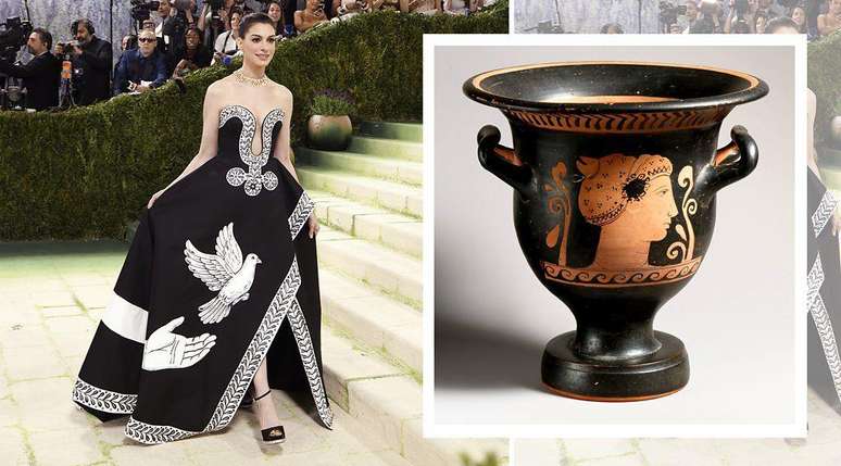 A atriz Anne Hathaway, ao lado de um vaso de terracota da Gr&eacute;cia antiga