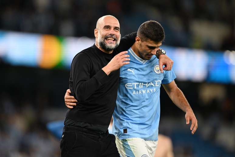 Rodri e Guardiola. (Photo by Michael Regan/Getty Images)
