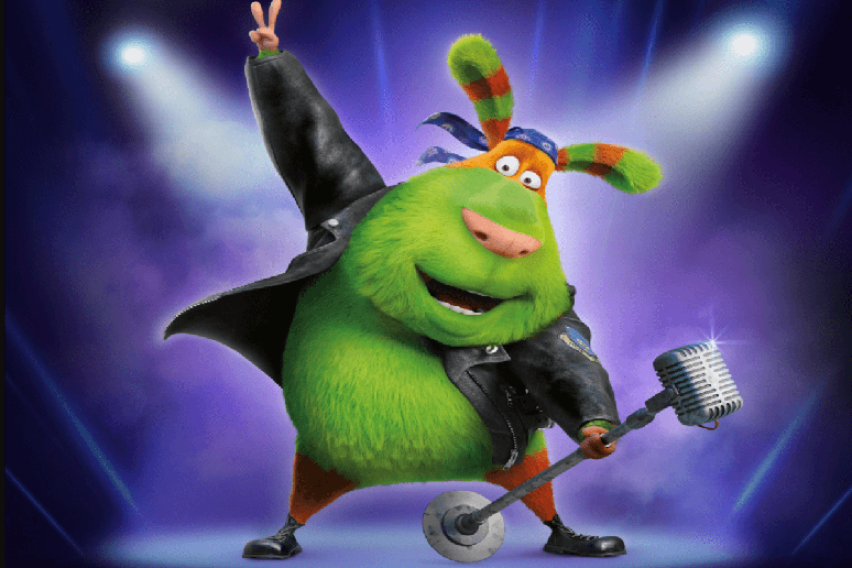 Personagem animado e peludo vestindo jaqueta de couro, segurando um microfone e fazendo pose de rock em um palco iluminado