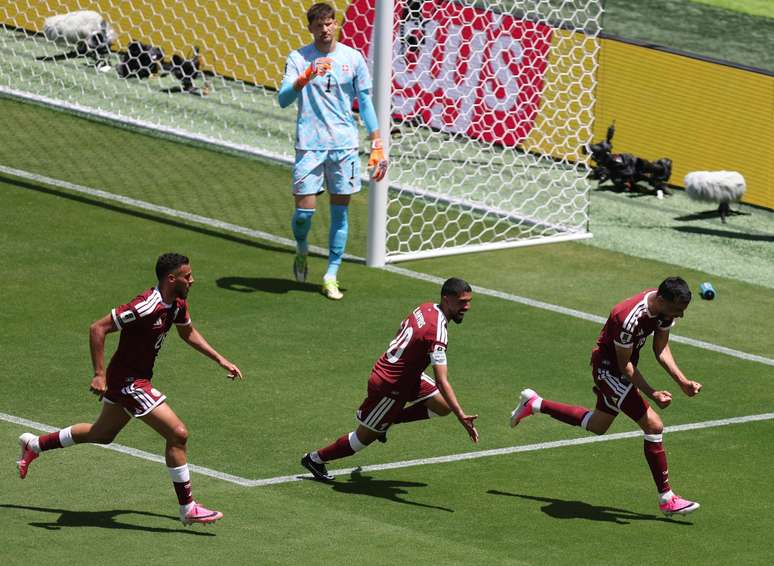SANTA CLARA, CALIFORNIA &ndash; JUNE 13: Boualem Khoukhi #16 of Qatar celebrates with teammates after scoring the team&rsquo;s first goal during the FIFA World Cup 2026 Group B match between Qatar and Switzerland at San Francisco Bay Area Stadium on June 13, 2026 in Santa Clara, California. (Photo by Fran Santiago/Getty Images)