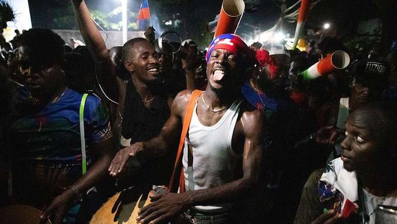 Torcedores comemoraram nas ruas de Porto Pr&iacute;ncipe quando o Haiti selou a qualifica&ccedil;&atilde;o para a Copa do Mundo