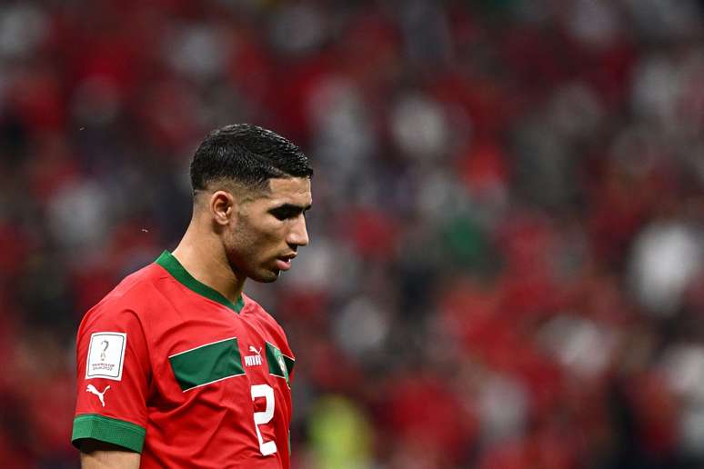 Morocco&rsquo;s defender #02 Achraf Hakimi walks on the pitch during the Qatar 2022 World Cup semi-final football match between France and Morocco at the Al-Bayt Stadium in Al Khor, north of Doha on December 14, 2022. (Photo by GABRIEL BOUYS / AFP) (Photo by GABRIEL BOUYS/AFP via Getty Images)