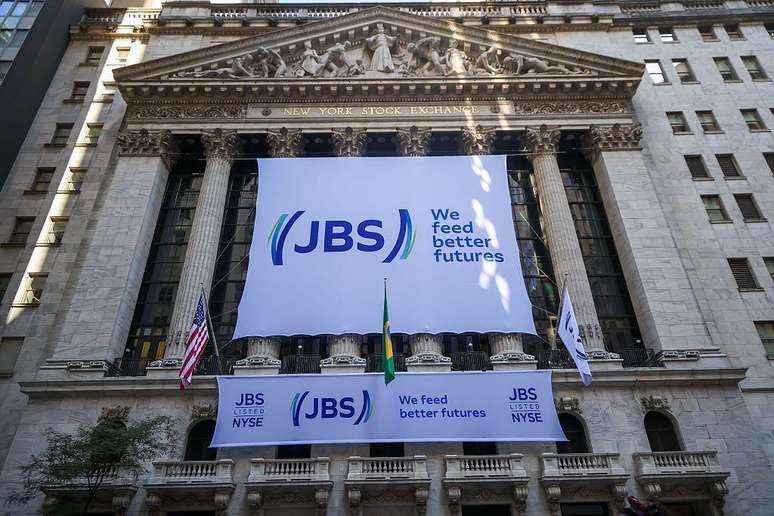 A conquista de Wall Street: a placa da JBS NV na Bolsa de Valores de Nova York marcou sua chegada ap&oacute;s anos de oposi&ccedil;&atilde;o