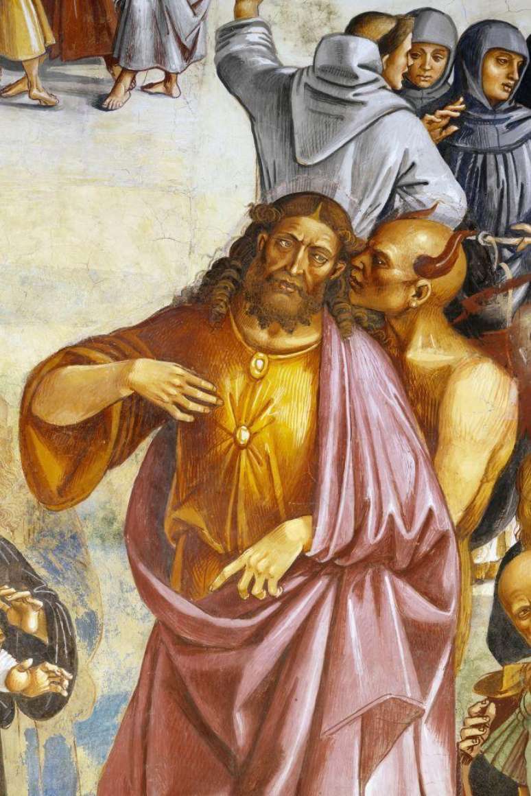 Sat&atilde;, ilustrado manipulando sua marionete, o Anticristo, para iludir as pessoas inocentes a vener&aacute;-lo no lugar de Jesus