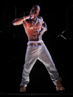 Tupac Shakur "hit" the stage at Coachella in hologram form this Sunday on April 15 in Indio, CA. The holographic image, "performed" "Hail Mary" and "2 of Amerikaz Most Wanted" during Dr. Dre and Snoop Dogg's set. Whilst many were amazed by the technology behind it, many fans reacted in horror on Twitter, calling it wrong, terrifying, etc. We're,honestly creeped out by it as well, but maybe that ties into our fear of mannequins. WATCH THE VIDEO BELOW AND TELL US WHAT YOU THINK!.Rihanna: Vampy With Black Hair & Sizzling Red Lips I Sean Paul Is Still Around