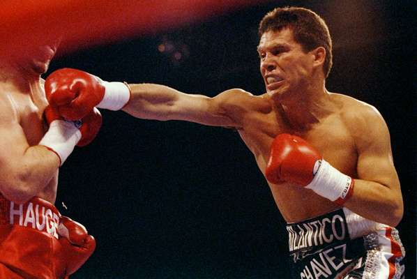 Julio Caesar Chavez throws a punch at Greg Haugen during a fight at Azteca Stadium in Las Vegas, Nevada, in 1993. Chavez won the fight. Chavez was a boxing legend for his warrior mentality, and now his son, Julio Chavez, Jr., has picked up the mantle.