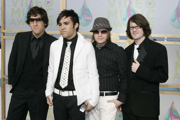 Fall Out Boy are back after a three-year hiatus with the announcement of the new album, 'Save Rock and Roll' and a new song, "My Songs Know What You Did In the Dark (Light Em Up)." To celebrate their return, we complied some pictures of the band throughout their pop career. Take a look at FOB from TV appearances to sharing the stage with Rihanna ahead.