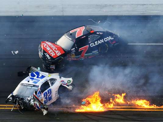 Kyle Larson, driver of the #32 Clorox Chevrolet, and Regan Smith, driver of the #7 Clean Coal Chevrolet, are involved in an incident at the finish of the NASCAR Nationwide race Saturday.