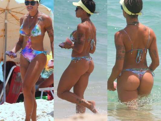 Aline Riscado exibe boa forma de maiô fio-dental na praia com filho na tarde desta terça-feira, dia 10 de janeiro de 2017