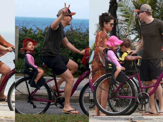 Thais Fersoza e Michel Teló param passeio de bike com filhos por virada no tempo à beira-mar nesta terça-feira, dia 13 de outubro de 2019