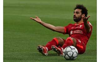 Mohamed Salah está no Liverpool desde 2017 e é um dos grandes ídolos do clube vermelho (Foto: PAUL ELLIS / AFP)