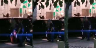 Ao ir embora, Madonna acena e envia beijos aos fãs que continuaram na porta do Copacabana Palace após o show de sábado (4)
