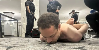 Foto do suspeito sob custódia, compartilhada por Donald Trump