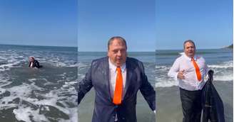 Jacquin entra no mar de terno.