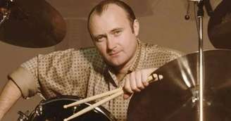 Quem canta com Phil Collins nos vocais de apoio de “Take Me Home”?