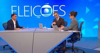 O momento em que Renata Vasconcellos passa a folha com a pergunta que Tralli não tinha localizado