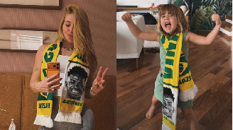 Maria Alice com faixa do Vini Jr.