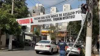 Faixa na Rua Lisboa alerta para roubos em Pinheiros; Prefeitura retirou no mesmo dia.