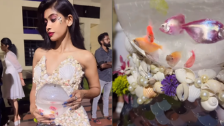 Vestido que tem como “acessório” um aquário com peixes vivos.