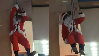 Papai Noel 'aventureiro' fica preso pela barba em rapel durante evento em MG