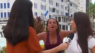 Mulher grita 'Globo lixo' durante transmissão ao vivo e faz gesto obsceno; vídeo / Reprodução: Globo