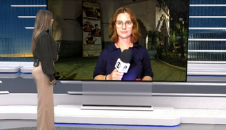 Juliana Guzzo (no telão), repórter da InterTV, afiliada da Rede Globo no Rio de Janeiro