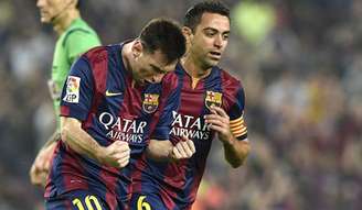 Messi e Xavi fizeram história juntos (Foto: Lluis Gene/AFP)