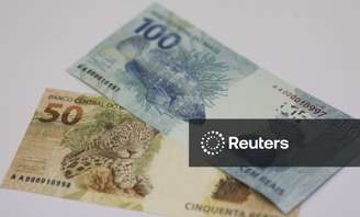 Notas de real
13/12/2010. REUTERS/Ricardo Moraes (BRAZIL - Tags: POLITICS)