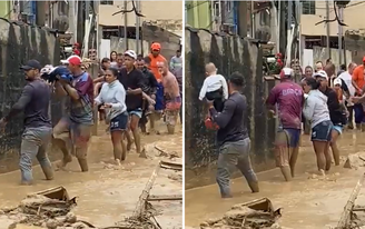 Moradores fazem corrente humana para resgatar bebê de colo 