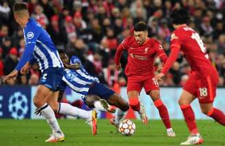 Liverpool entrou em campo já classificado e manteve a invencibilidade Foto: ANTHONY DEVLIN / AFP)