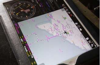 <p>Área de busca vista em iPad de oficial militar a bordo de aeronave durante uma missão para encontrar o avião desaparecido da Malaysia Airlines</p>