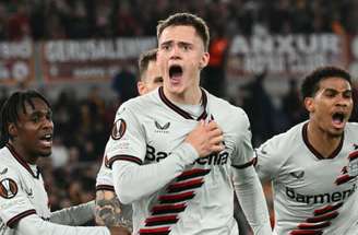 Alberto Pizzoli/AFP via Getty Images - Legenda: Florian Wirtz celebra o gol que abriu o caminho para a vitória do Leverkusen contra a Roma -