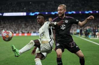 Thomas Coex/AFP via Getty Images - Legenda: Vini Jr foi o grande nome da classificação do Real Madrid sobre o Bayern -