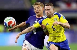  Maeda corre para comemorar o gol do Japão. Mas  Suécia empataria pouco depois. Foto Stacy Revere/Getty Images