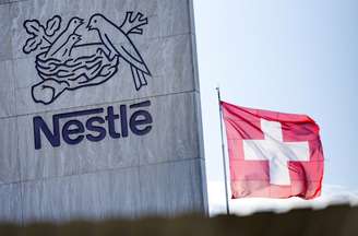 FILE PHOTO: A Swiss flag flutters on the headquarters of Nestle in Vevey, Switzerland, November 25, 2024. REUTERS/Denis Balibouse/File Photo