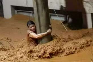 Edna se agarrou a um poste para se salvar em enxurrada em Ubá (MG)