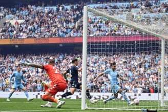 Manchester City é campeão da Premier League 2021/2022 (Foto: OLI SCARFF / AFP)