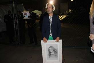 <p>O figurante André Felipe de Oliveira, 28 anos, comprou um quadro de R$ 2 mil com o rosto de Gisele Bündchen para entregar à brasileira</p>