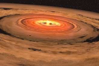 Representação artística de disco de poeira e gás ao redor de estrela, em imagem de arquivo