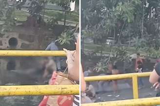 Populares retiram corpo de mulher da água, em Santos