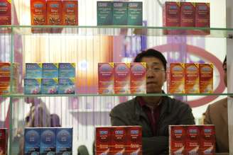 A Chinese visitor looks at condoms at the Beijing International Sex Supplies Exhibition. Zhang Peng/LightRocket via Getty Images
