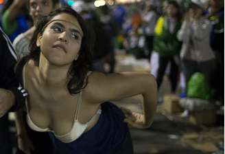 <p><strong>27 de julho</strong> - Manifestante participa de protesto no Rio</p>