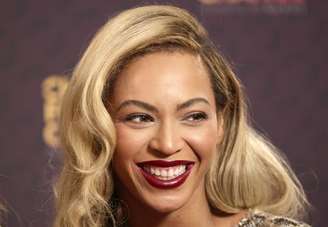 Cantora Beyoncé posa para fotos no concerto "The Sound of Change" no Estádio de Twickenham, em Londres. Beyoncé surpreendeu os fãs nesta sexta-feira com o lançamento do quinto álbum gravado em estúdio, composto de 14 músicas e 17 vídeos, informou a Columbia Records, uma divisão da Sony. 01/06/2013.