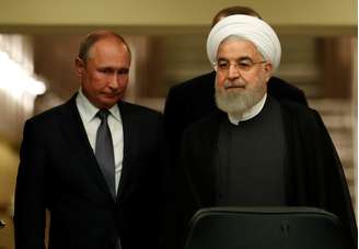 Presidente do Irã, Hassan Rouhani, e presidente da Rússia, Vladimir Putin, chegam para entrevista coletiva em Ancara
16/09/2019
REUTERS/Umit Bektas